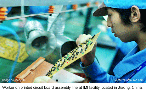 Worker on printed circuit board assembly (PCBA) line at IMI facility in Jiaxing, China.